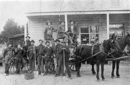 Telephone line workers at Sawtell's store